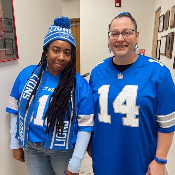 happy-turris-employees-in-Detroit-lions-jerseys