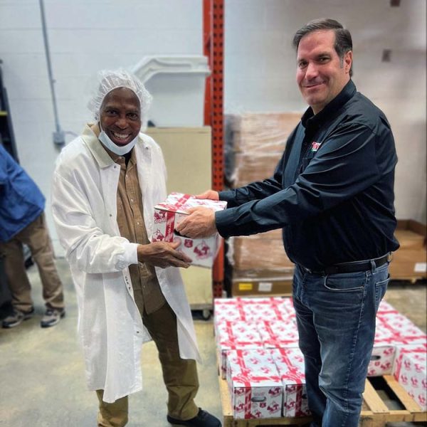 Turris-employee-accepting-Christmas-gift